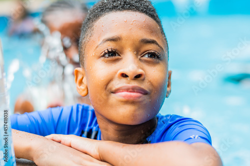 Portrait of an African American boy in pool