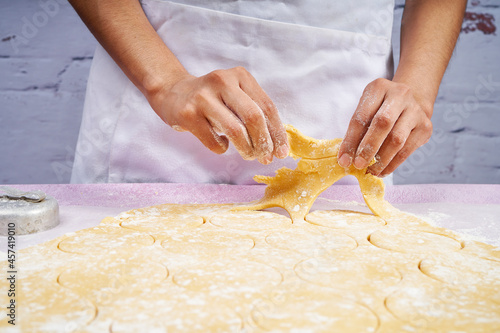 Removing the dough after cutting the cookies photo