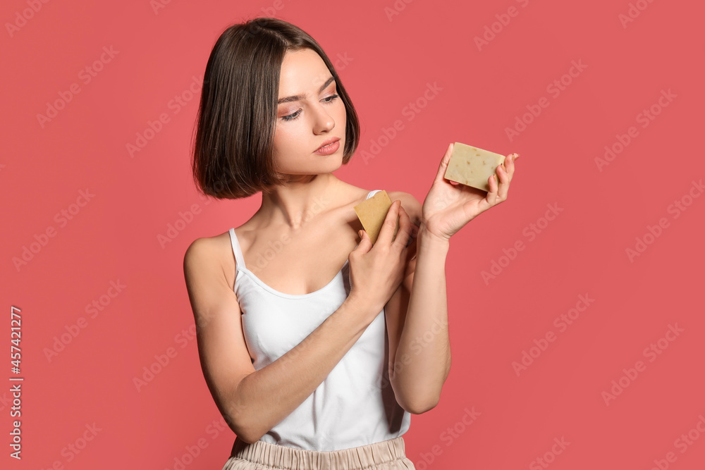 Beautiful young woman with soap on color background Beautiful young woman with soap on color background