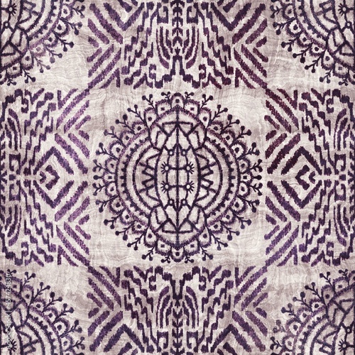 Seamless grungy tribal ethnic rug motif pattern. High quality illustration. Distressed old looking native style design in faded purple and cream colors. Old artisan textile seamless pattern.