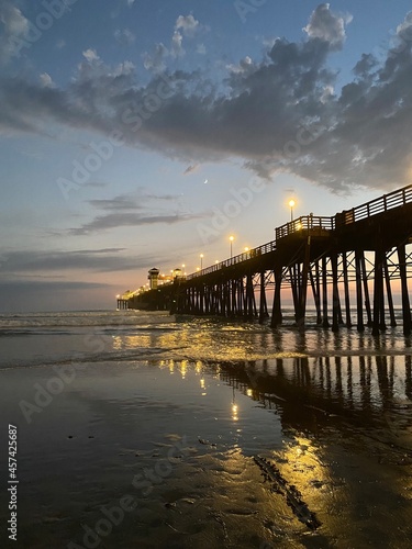 Lights on pier at sunset © Laurel