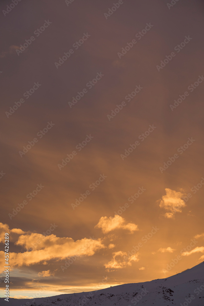 Beautiful sunset with a group of clouds in the sky