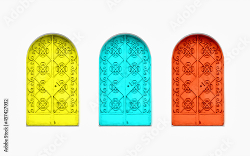 Three colored metal doors in the middle of nowhere with beautiful colors