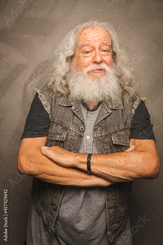 Grizzled Old Rogue with Long Gray Hair and White Beard Clowns for the Camera photo