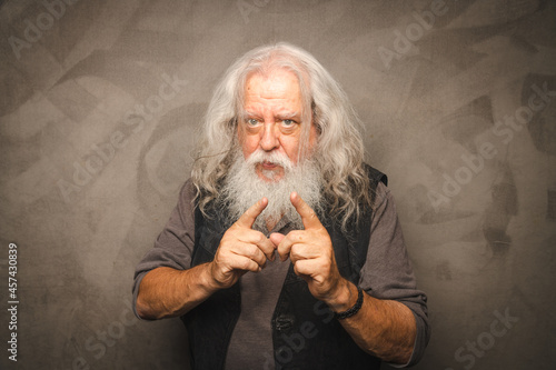 Grizzled Old Rogue with Long Gray Hair and White Beard Clowns for the Camera photo