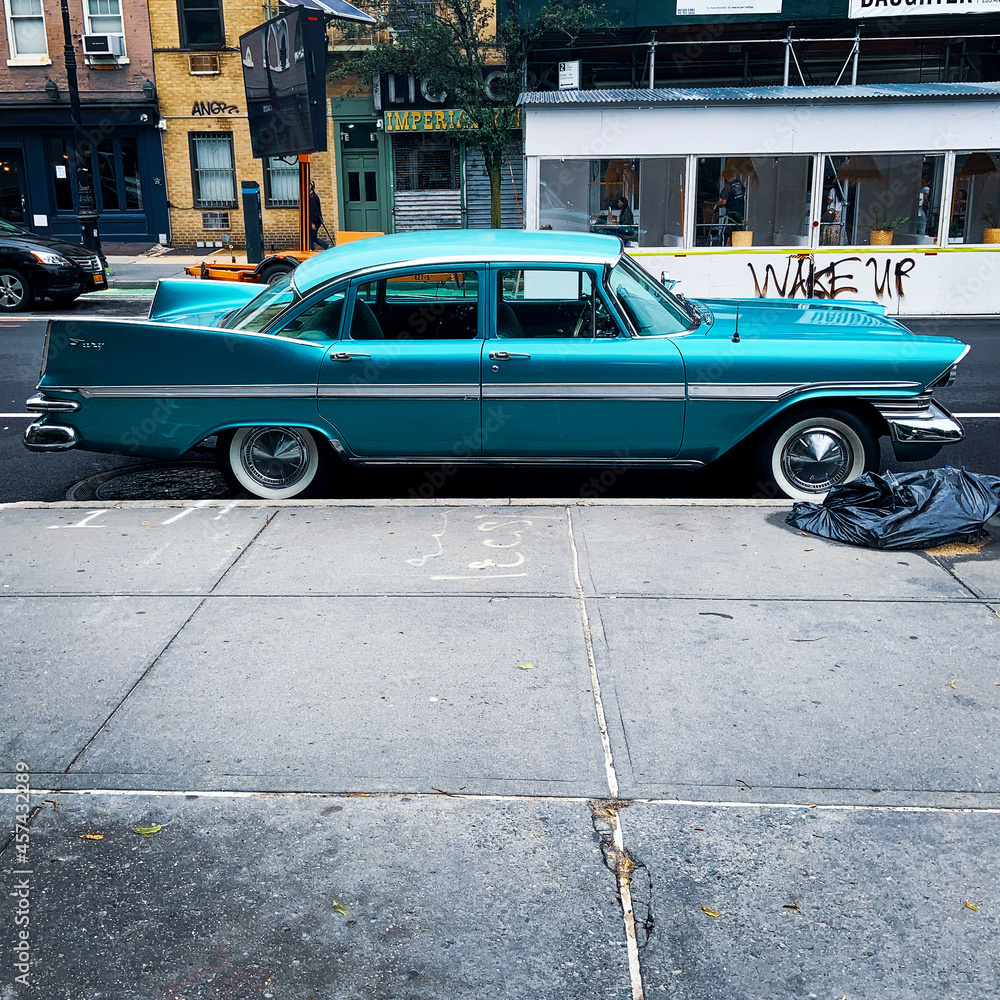 Vintage classic turquoise car parked in the West Village, NYC. 