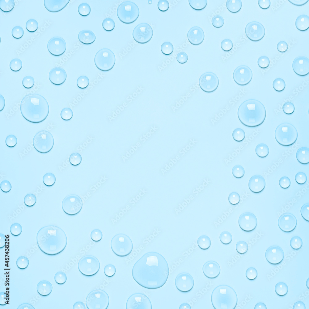 Frame of Water drops on a pastel blue background. Water texture close up. Backdrop glass covered with drops of water. Water bubbles.