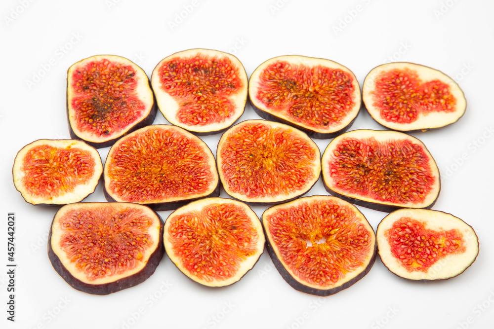 fresh figs cut into braids on a white background. vitamin organic healthy food fresh figs cut into braids on a white background. vitamin organic healthy food