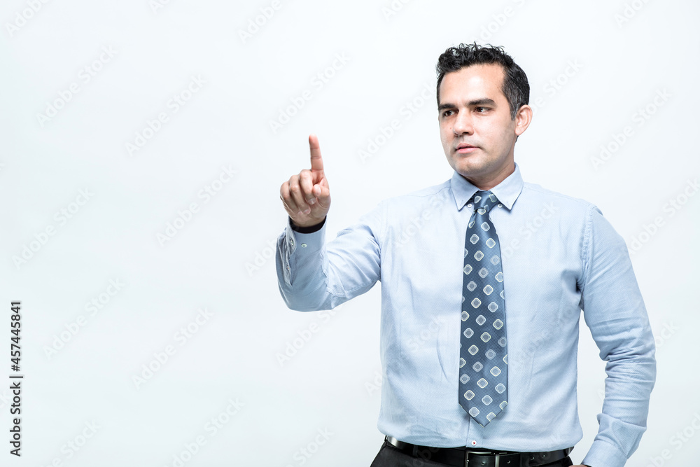 An Asian working man in an office suit is standing pointing with a finger, on white background, with copy space. An Asian working man in an office suit is standing pointing with a finger, on white background, with copy space.