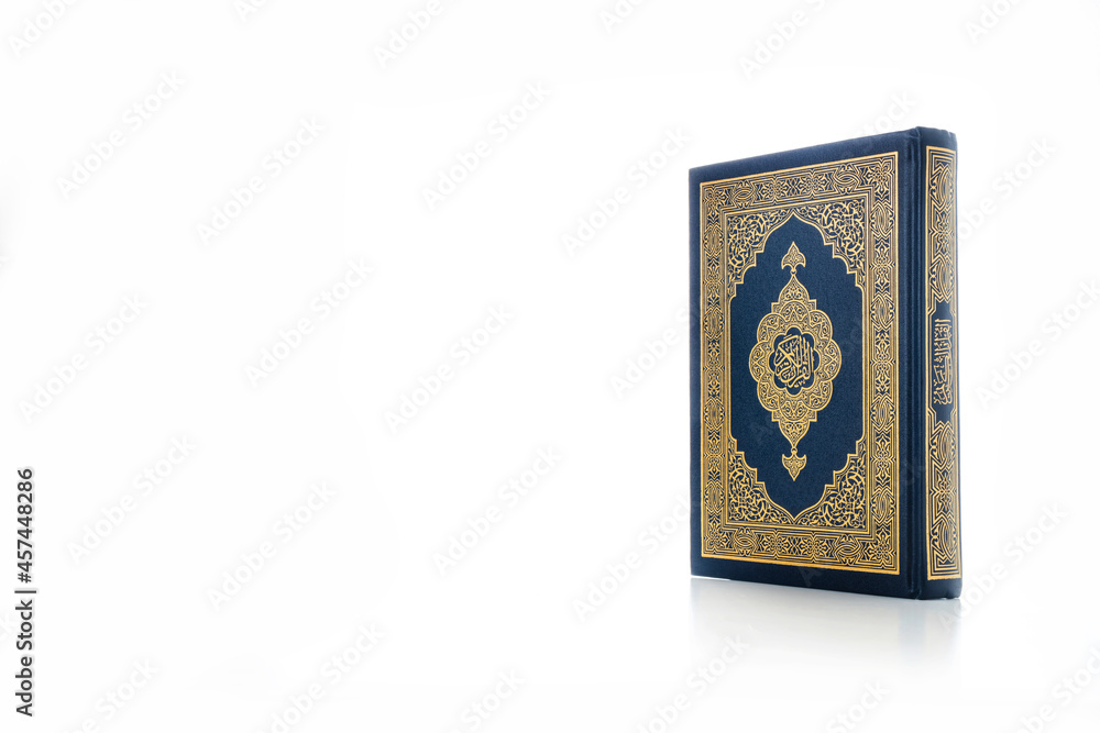 Islamic concept - The Holy Al Quran with written Arabic calligraphy meaning of Al Quran, Arabic word translation: The Holy Al Quran (holy book of Muslim), on white background, with copy space. Islamic concept - The Holy Al Quran with written Arabic calligraphy meaning of Al Quran, Arabic word translation: The Holy Al Quran (holy book of Muslim), on white background, with copy space.