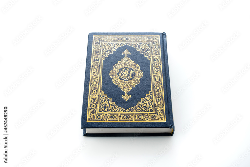 Islamic concept - The Holy Al Quran with written Arabic calligraphy meaning of Al Quran, Arabic word translation: The Holy Al Quran (holy book of Muslim), on white background, with copy space. Islamic concept - The Holy Al Quran with written Arabic calligraphy meaning of Al Quran, Arabic word translation: The Holy Al Quran (holy book of Muslim), on white background, with copy space.