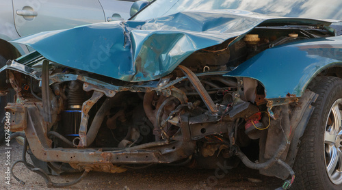 Front view of damaged car crash accident on the road. car damaged and broken by accident on road