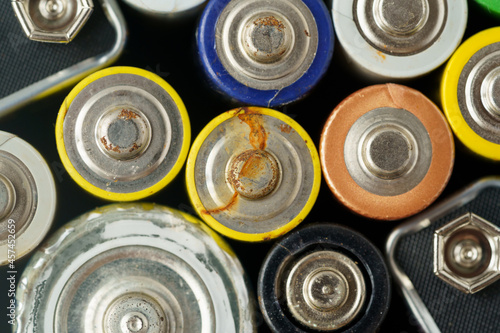 Close up top view of used battery. lot of AA batteries. Electronic hazardous waste, recycling concept 