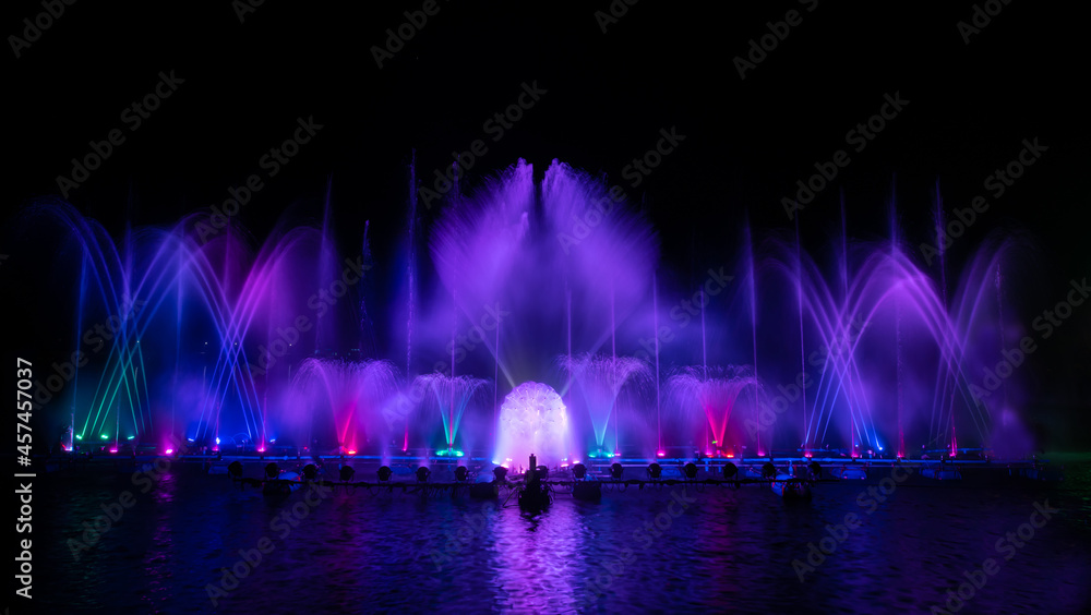 The colorful fountain dancing in celebration festival with dark night sky background.	