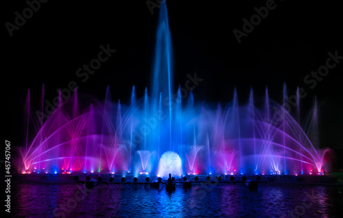 The colorful fountain dancing in celebration festival with dark night sky background. 