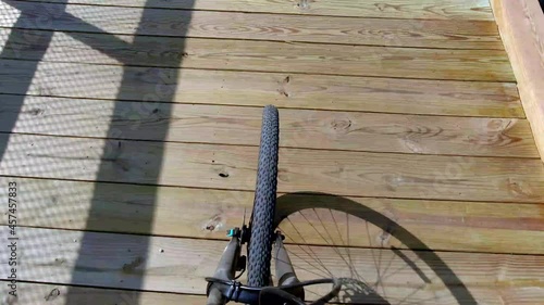 lady rides bike tight shot across high bridge in farmville virginia photo