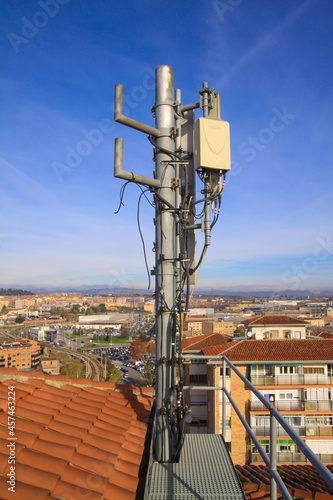 telecommunications tower of different mobile phone, radio and television operators with masts and microwave radio link antennas, 4g and deployment of 5g generation in cities and rural areas  photo