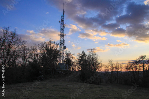telecommunications tower of different mobile phone, radio and television operators with masts and microwave radio link antennas, 4g and deployment of 5g generation in cities and rural areas