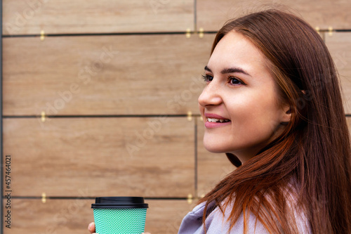 Coffee to go concept. Young woman portrait. 