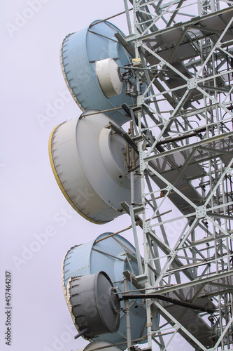 telecommunications tower of different mobile phone, radio and television operators with masts and microwave radio link antennas, 4g and deployment of 5g generation in cities and rural areas photo