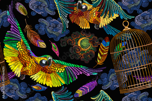 Colorful flying ara parrots  moon and golden cage. Horizontal seamless pattern. Fashionable template for design of clothes  textiles. Macaws. Brazilian birds. Jungle paradise background