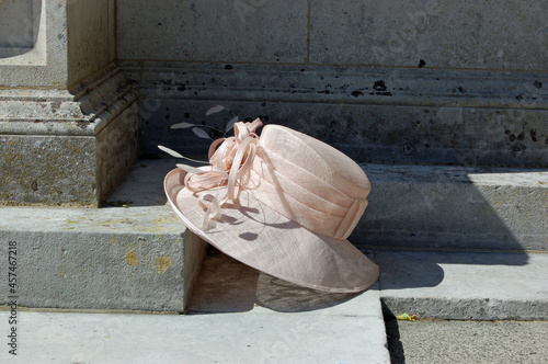 Lady's hat resting on church step, wedding still life