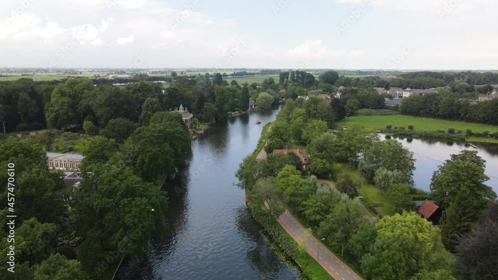 Aerial drone view of the river Nes Stichtse Vecht between Amsterdam and Utrecht with historic houses villa, along the water. Aerial drone view of the river Nes Stichtse Vecht between Amsterdam and Utrecht with historic houses villa, along the water.