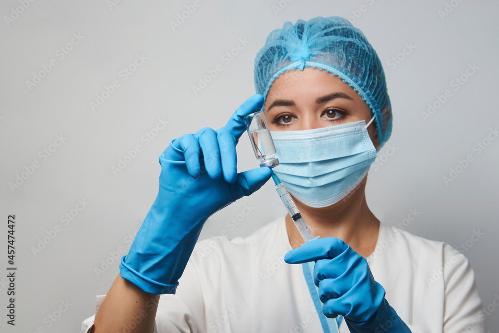 Female doctor injecting injection vaccine, close-up Female doctor injecting injection vaccine, close-up