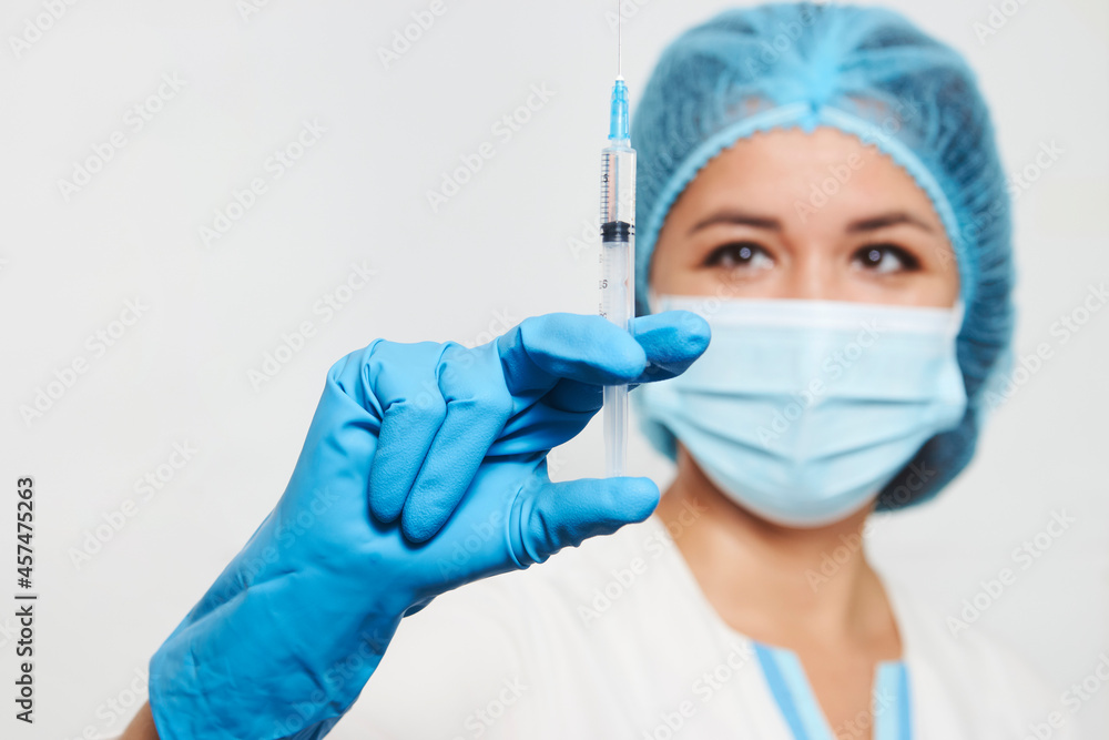 Female doctor injecting injection vaccine, close-up Female doctor injecting injection vaccine, close-up
