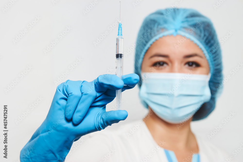 Female doctor injecting injection vaccine, close-up Female doctor injecting injection vaccine, close-up
