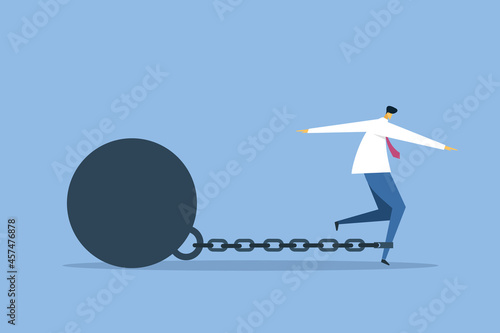 Conceptual illustration of a business man with his legs tied to a heavy metal ball