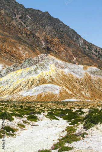 Deposits on the rocks surrounding the Stefanos crater of the volcano on the island of Nisyros