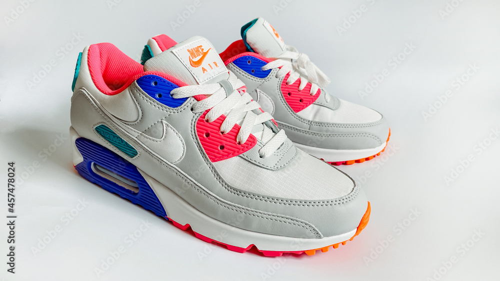 The famous Nike Air Max 90 sneakers on a white background. Iconic shoe with  waffle sole, stitched overlays and classic thermoplastic accents and  beautiful juicy colors. Stock 写真 | Adobe Stock