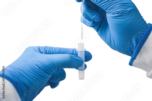 Medical personnel infusion a cotton swab to saline extraction tube for diagnostic covid-19,Coronavirus infectious protective concept