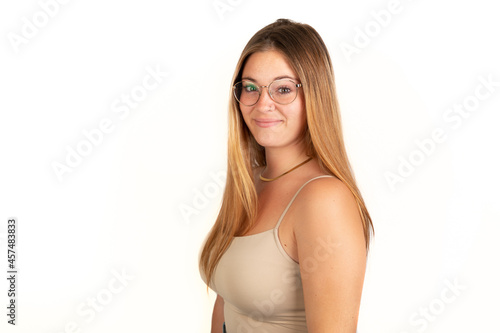 Handsome blonde woman smiling looking at camera. White background. 20 - 22 years old. White European woman.
