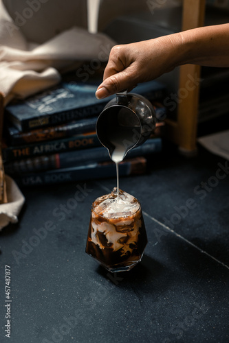 iced coffee served on black table at cafe   