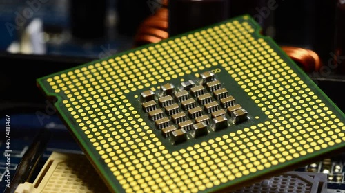 detail of the surface of the computer cpu on a motherboard close-up. macro shot.