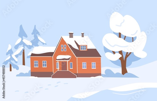 Village house and trees covered with snow. Wintery country landscape with woo...