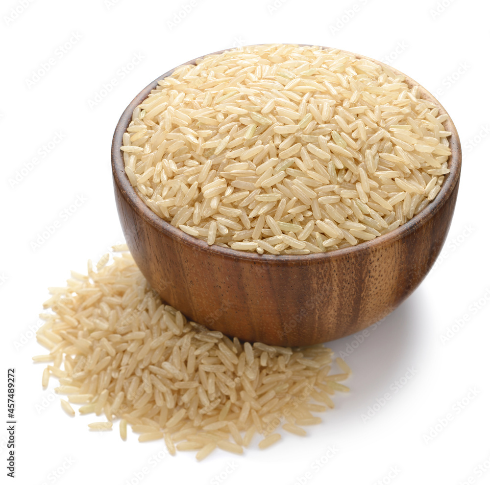 uncooked long brown rice in the wooden bowl, isolated on white uncooked long brown rice in the wooden bowl, isolated on white