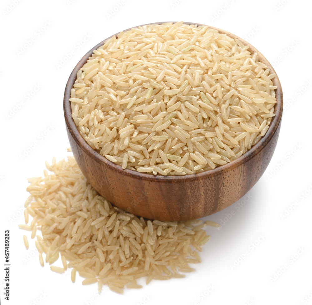 uncooked long brown rice in the wooden bowl, isolated on white uncooked long brown rice in the wooden bowl, isolated on white