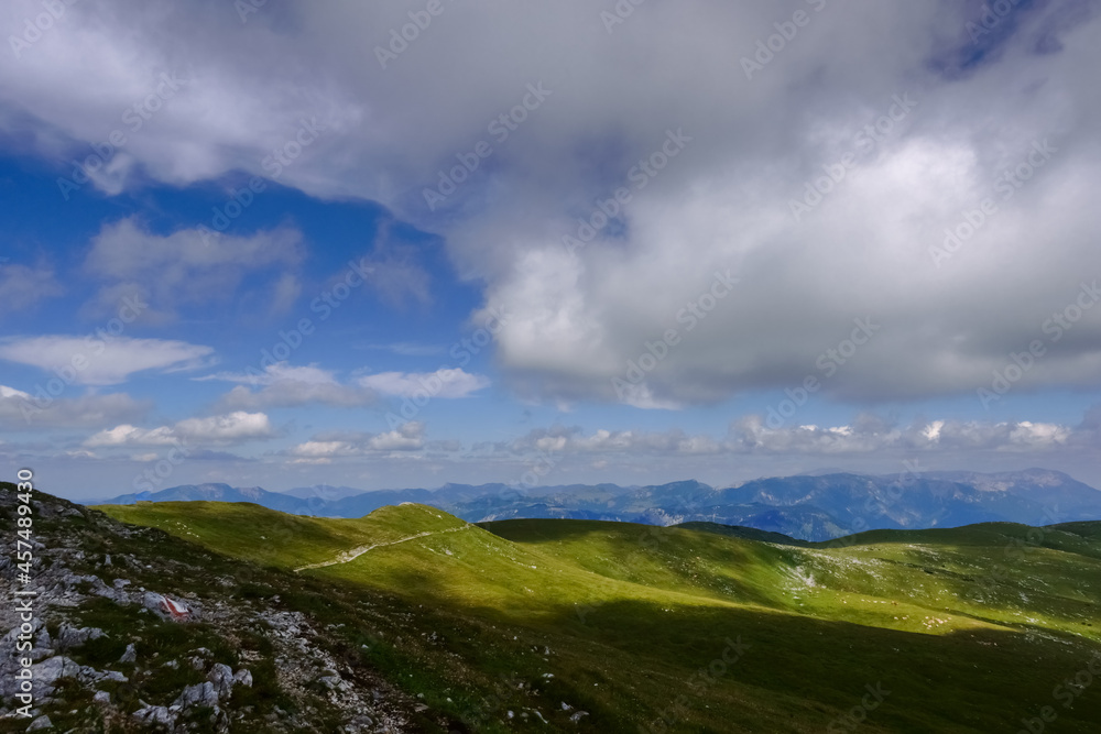 shadow and sun from the clouds on a amazing landscape on the top from a mountain shadow and sun from the clouds on a amazing landscape on the top from a mountain