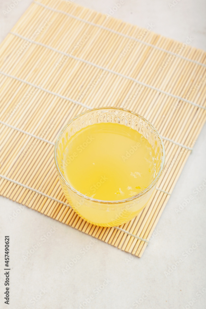 Yuzu tea or yuja tea in glass, top view. Popular asian citron tea. Selective focus, copy space Yuzu tea or yuja tea in glass, top view. Popular asian citron tea. Selective focus, copy space