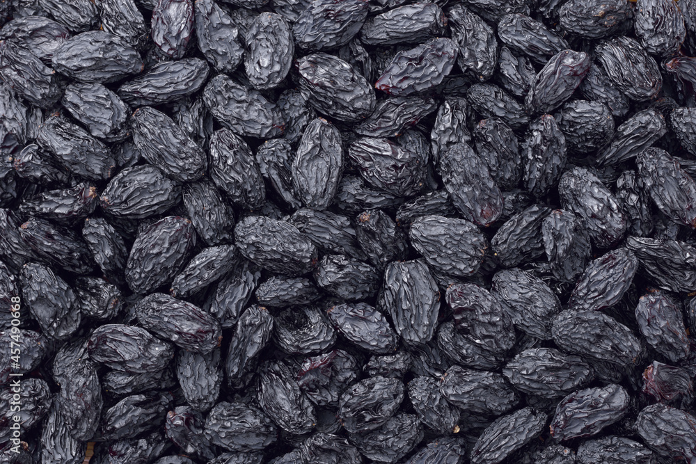 food backgrounds of black raisins, top view food backgrounds of black raisins, top view