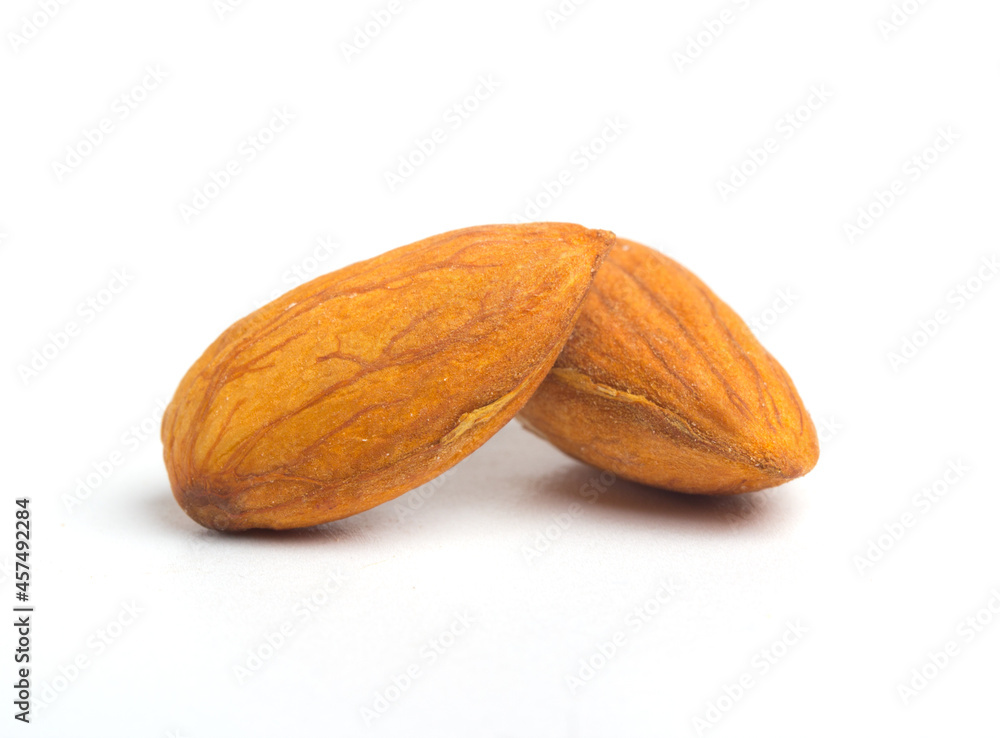 Two almonds close-up on white background photo Two almonds close-up on white background photo