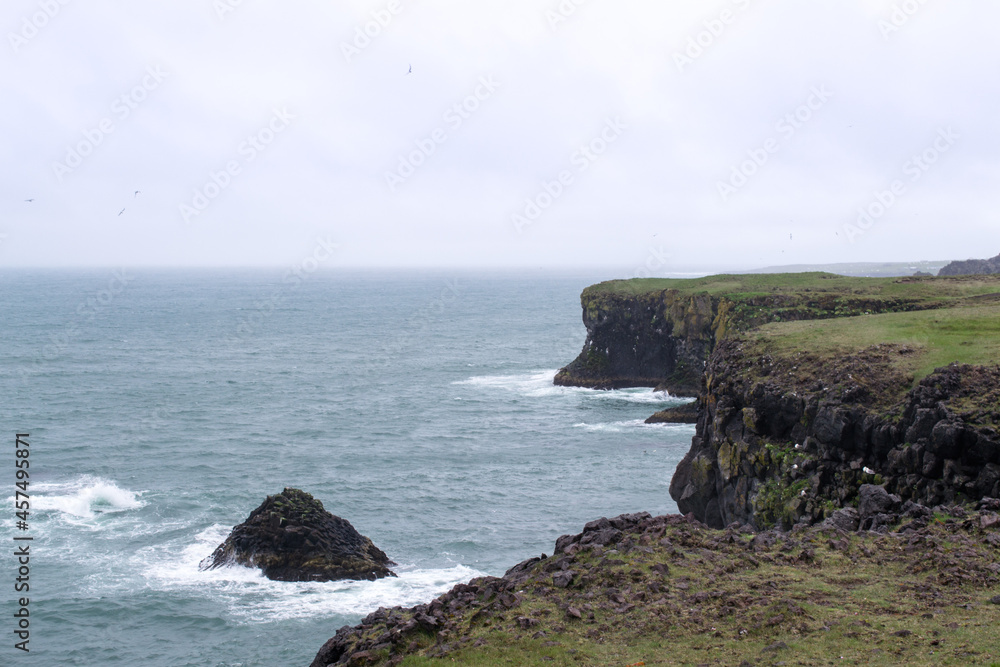 View of the fjords coastline at Snaefellsnes Peninsula, Iceland. Cloudy day during summer