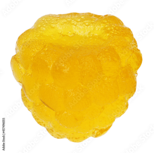 Delicious gummy yellow raspberry candy isolated on white