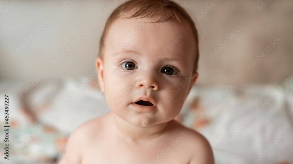 Baby boy on a bed