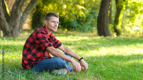 Man resting in park outdoors. © Sea Wave