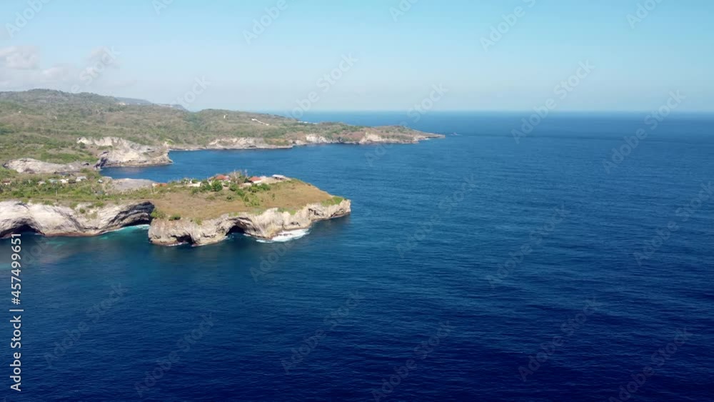 Fly around rock cliff in tropical island Nusa Penida, Indonesia. High quality 4k aerial footage Fly around rock cliff in tropical island Nusa Penida, Indonesia. High quality 4k aerial footage