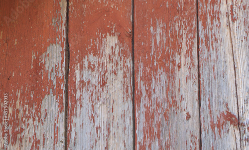 Wooden background - the red old paint peeling off